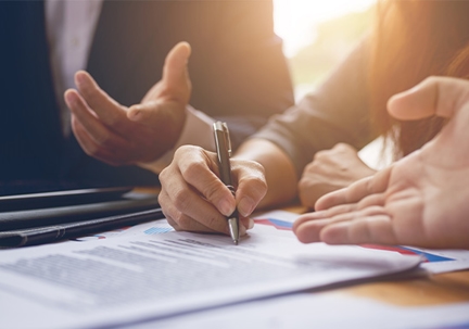 Lawyers signing paperwork
