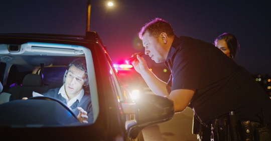 police officer checking the driver
