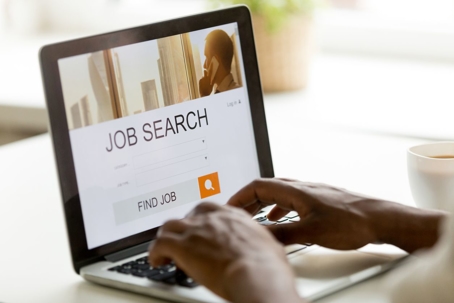 african-american-person-on-laptop-job-search