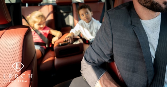 dad driving with two kids in backseat