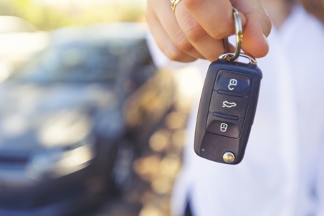 person-holding-ring-of-car-key
