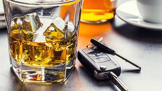 Whiskey glass and car keys