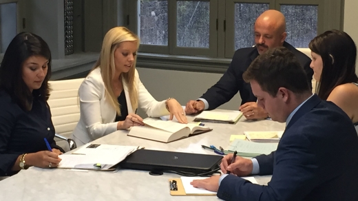Attorneys around a desk
